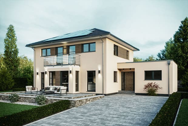 Modernes zweistöckiges Einfamilienhaus mit hellen Fassade, Flachdach mit Solarpaneelen und gepflasterter Einfahrt in grüner Umgebung