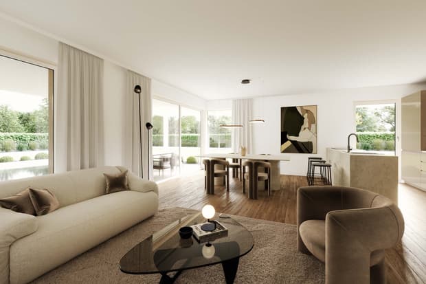 Modernes offenes Wohnzimmer mit großen Fenstern.