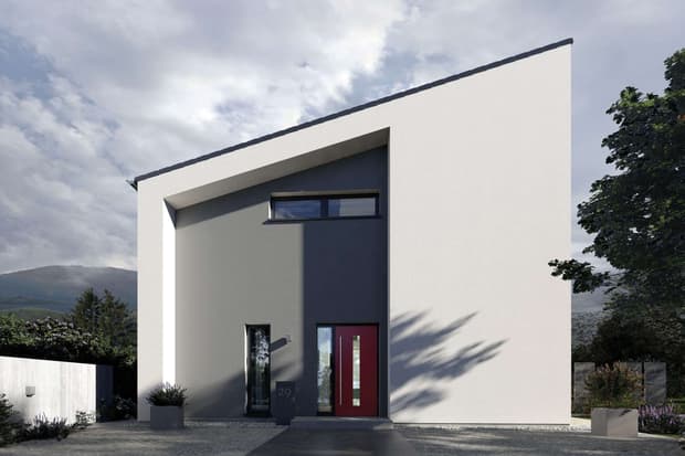 Modernes Musterhaus mit schrägem Dach, grauer Fassade und roter Eingangstür in minimalistischer Architektur.