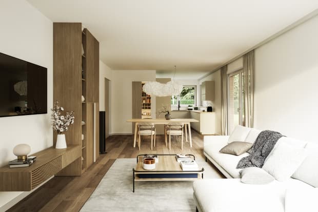 Offenes Wohnzimmer mit weißem Sofa, Holzdielen, Holztisch, Hängelampe und großer Fensterfront zum Garten