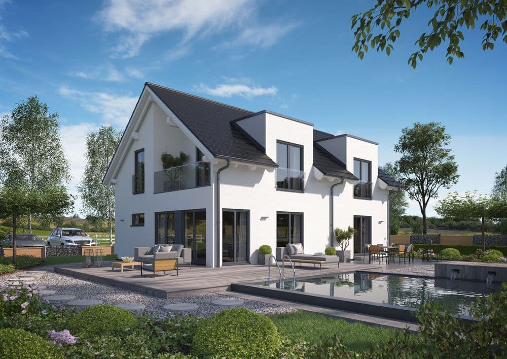 Außenansicht auf das Einfamilienhaus mit Querhäusern und Loggia